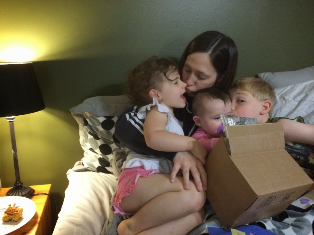 April getting hugs from the kids after opening her presents