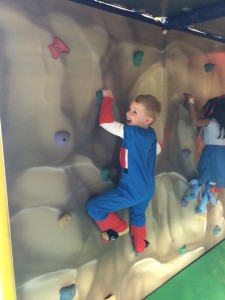 Captain America (Brecken) rock climbing