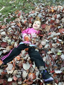 Madiana playing in the leaves