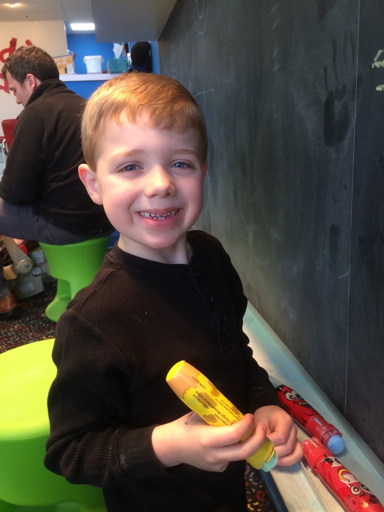 Brecken was excited to write on the chalkboard after his haircut.