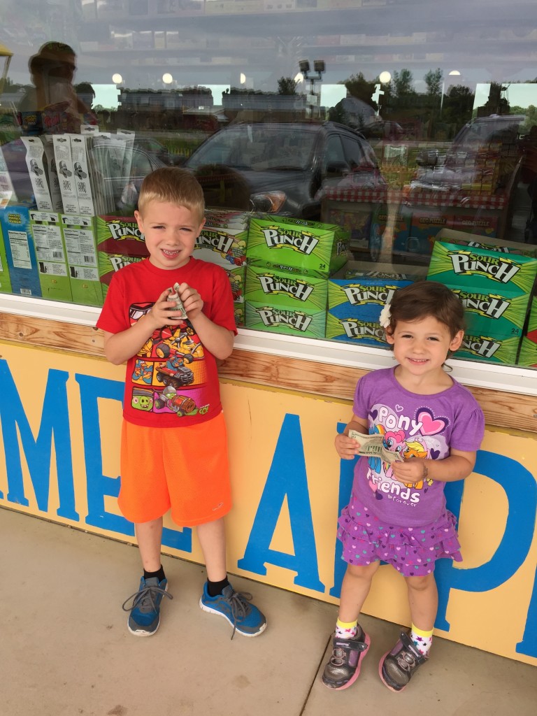 Brecken and Madiana holding onto their money they want to spend inside.