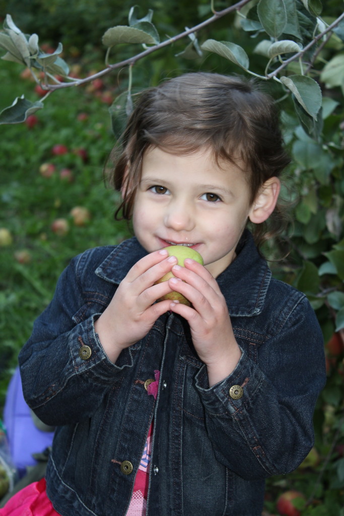 Madiana eating an apple