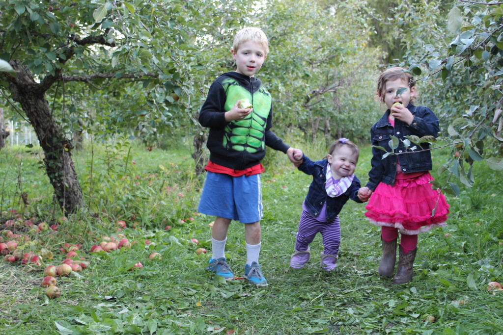 Brecken, Gretchen, and Madiana walking around the Orchard